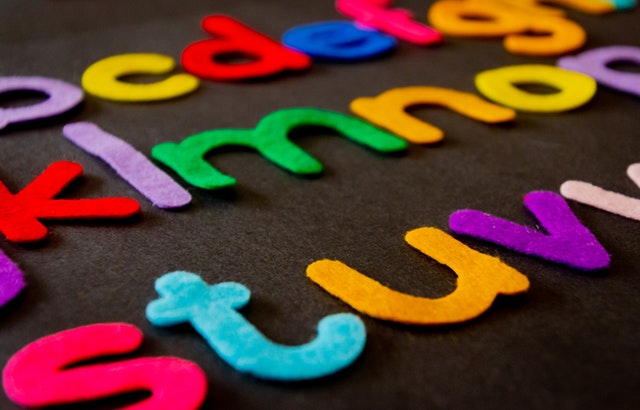 Felt letters attached to a board in alphabetical order.
