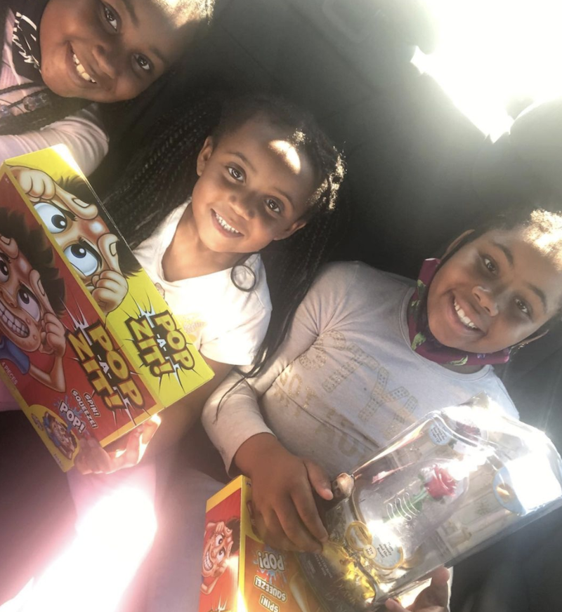 Three little girls are getting ready to play the game Pop A Zit.